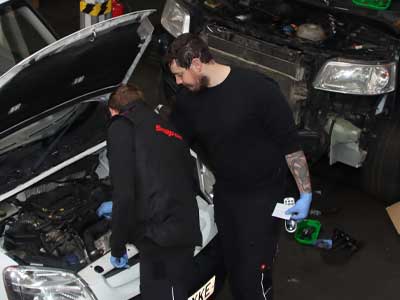 Our car mechanic team at work on a van