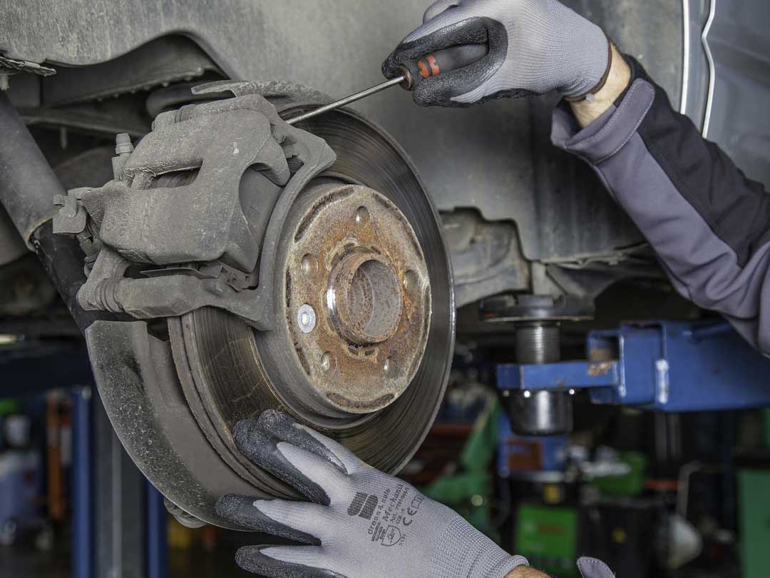 A Mechanic Changing Brake Pads