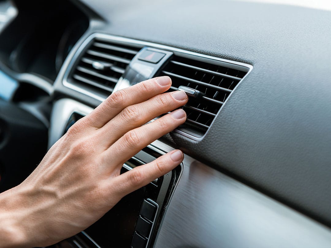Man Touching Air Conditioner Switch Car