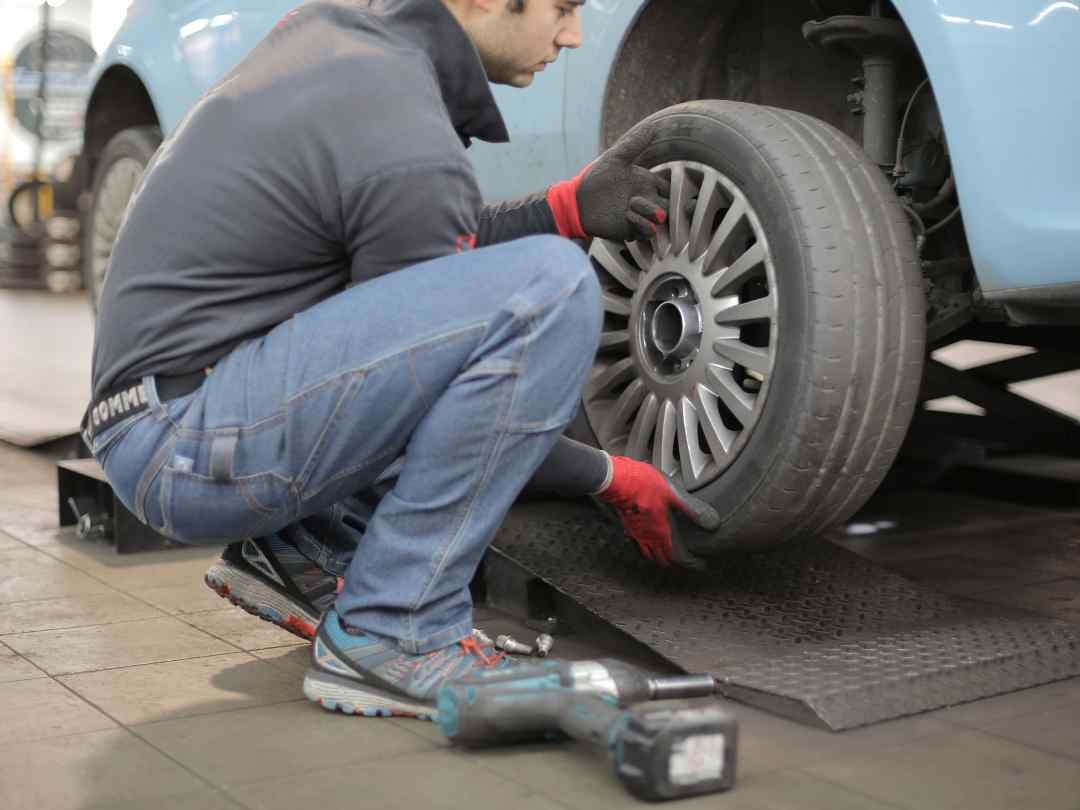 Man changing car tyre