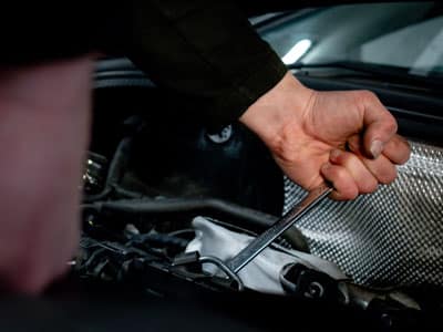 Using tool to work under car bonnet